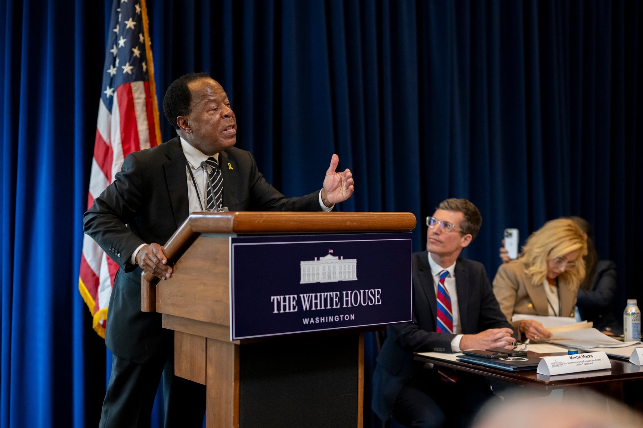 Leo J. Terrell speaks at a lectern at a White House event.