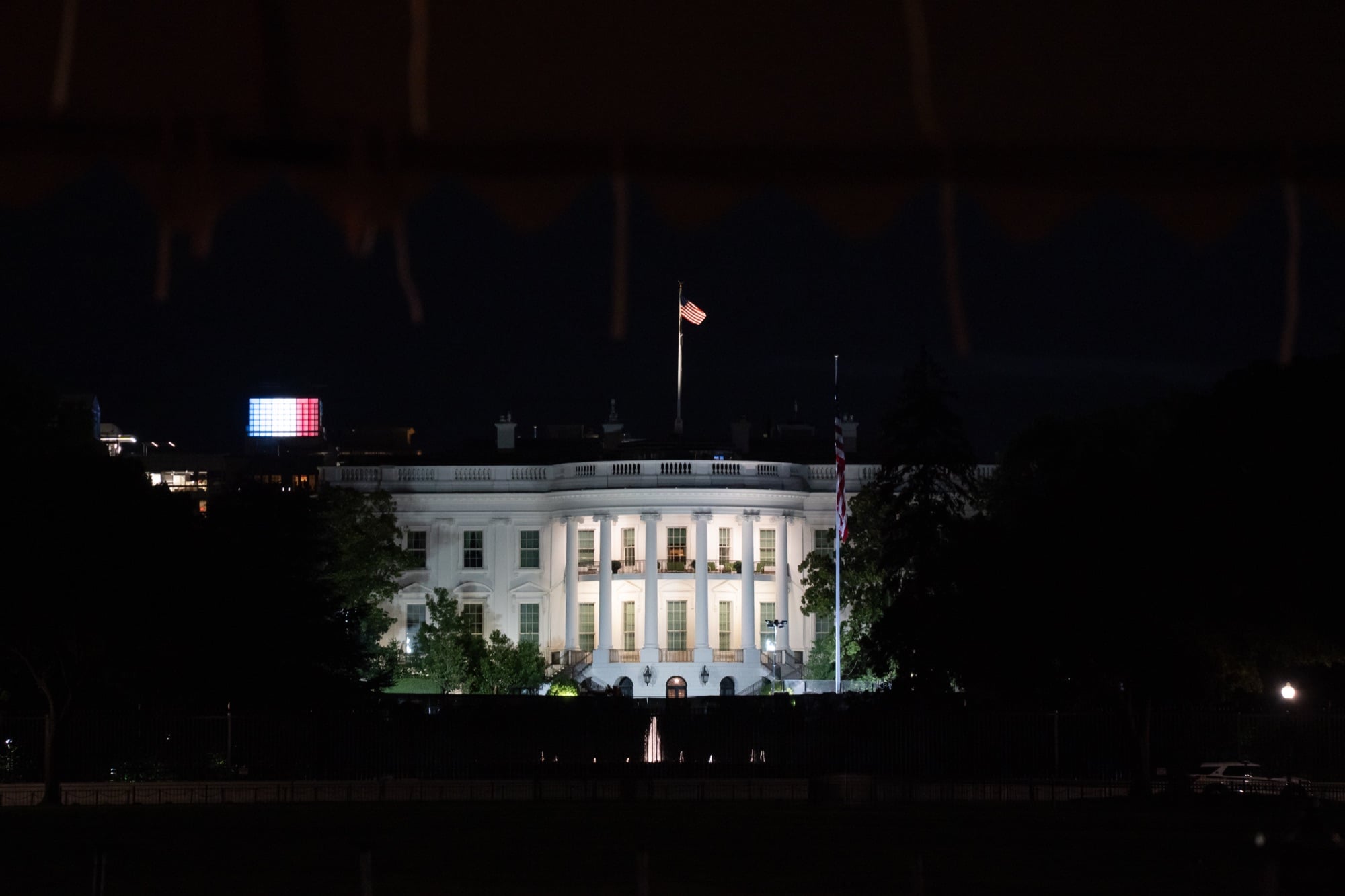 The White House lit up at night.